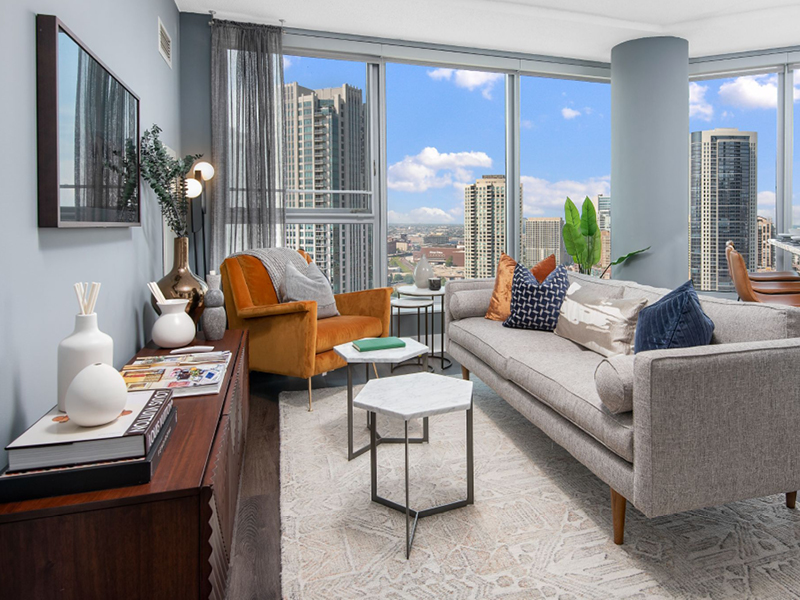 Residence living area with floor to ceiling windows and breathtaking views of Chicago